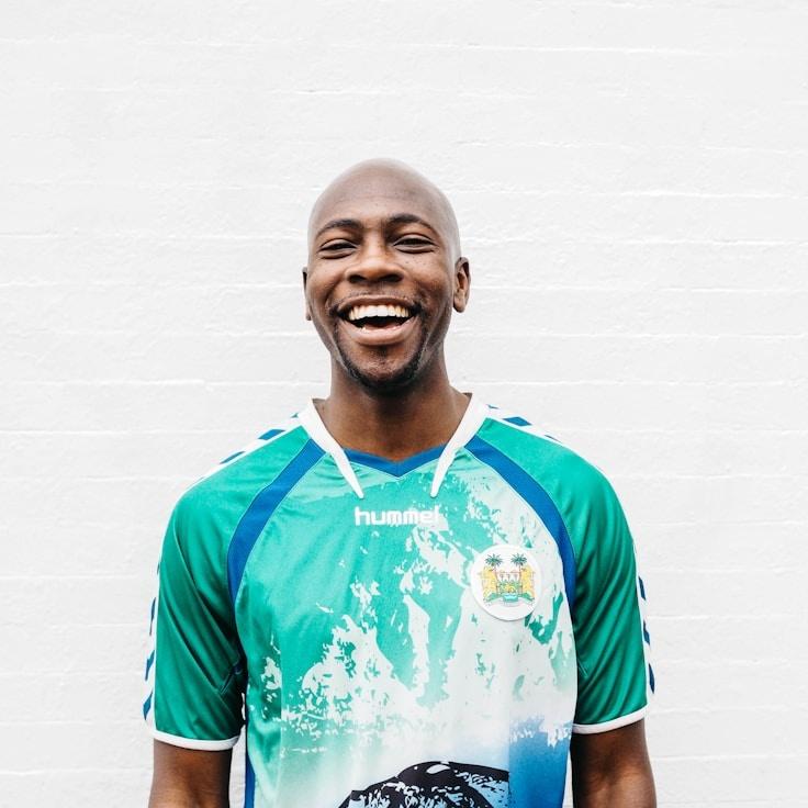 Kaveri Mehta, Lead Design Curator at Compass Grove Panel, reviewing corporate floral arrangements